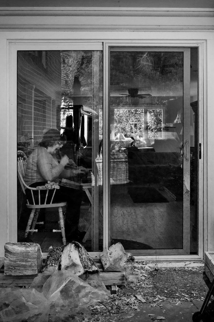 Woman working through a window