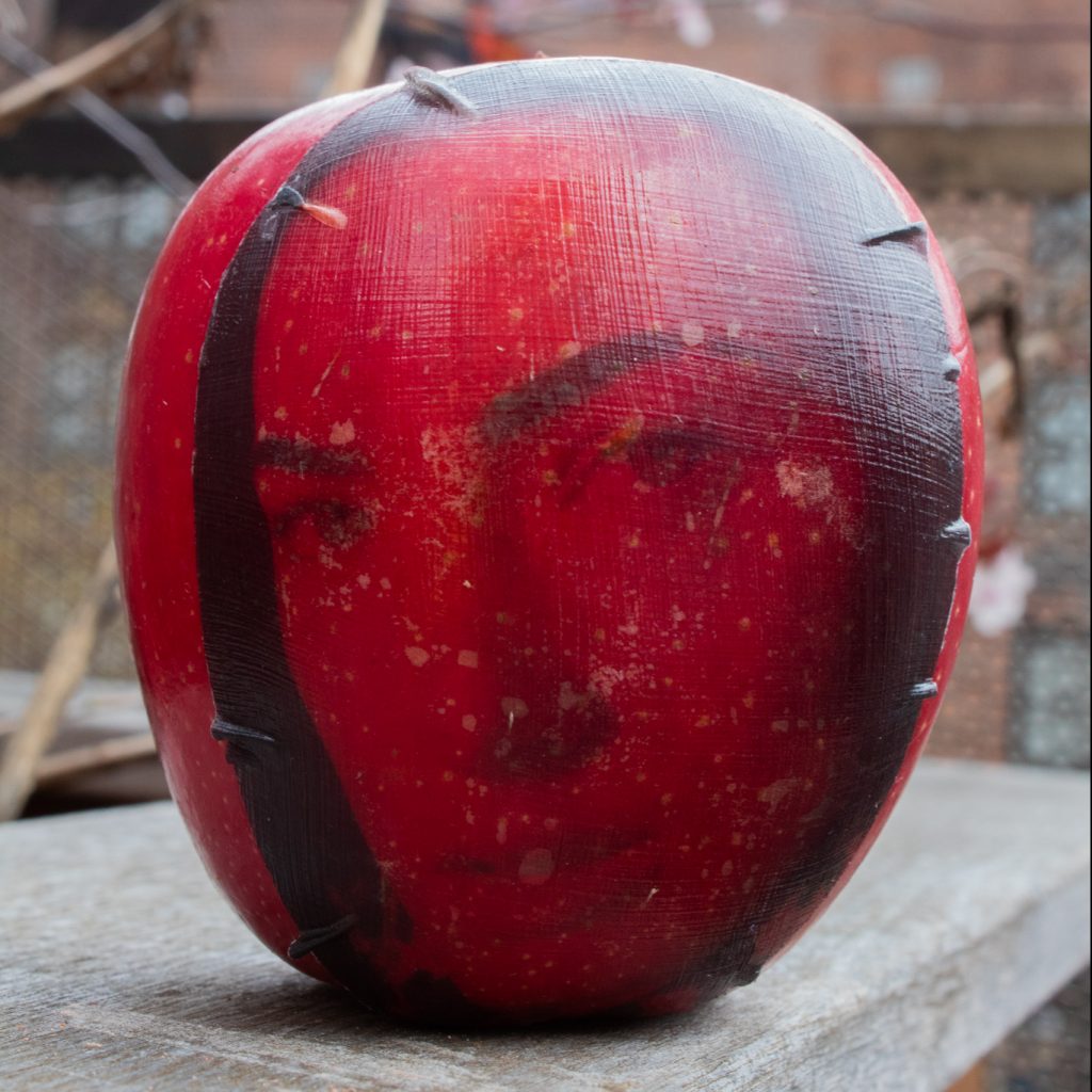 An apple with a gel emulsion transfer of a woman